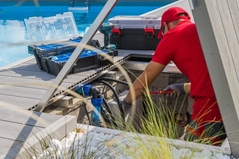 Worker fixing a residential pool