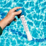 Pool thermometer to measure the temperature of the pool water in spring summer.