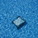 robotic pool cleaner submerged in water